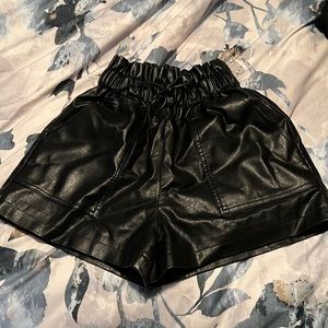 Faux leather women’s size small dress shorts w pockets.  New without tags